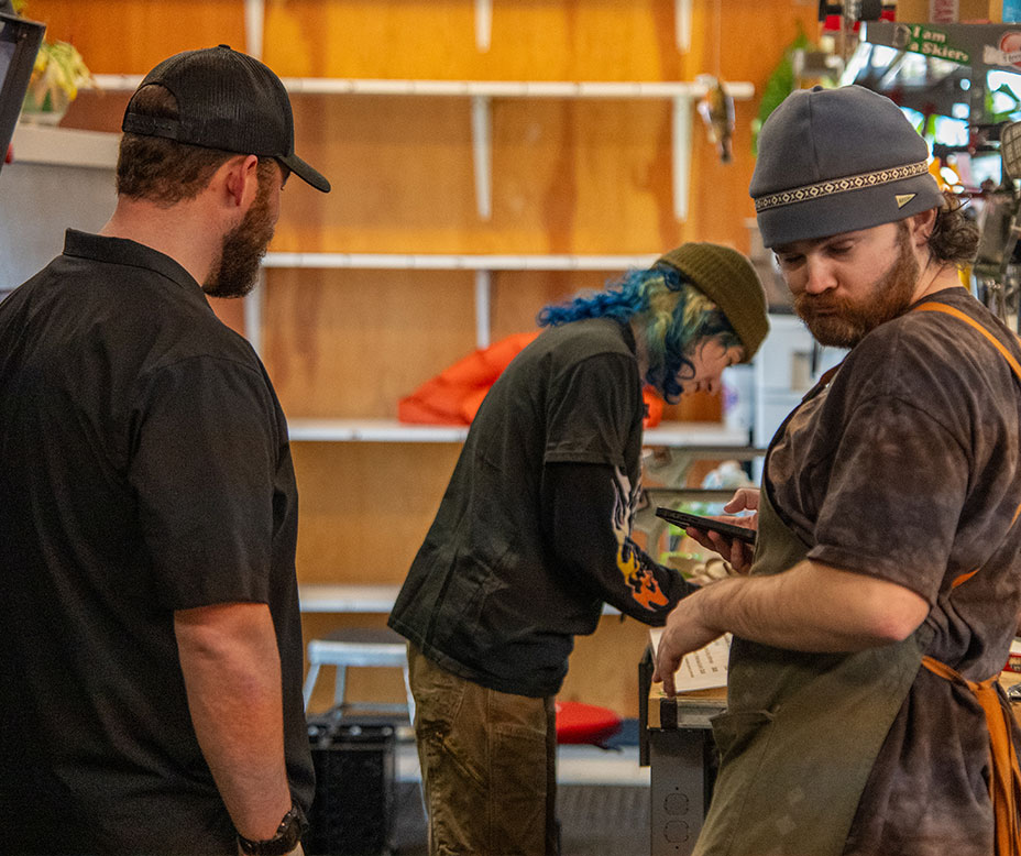 team at the Creel working on skis